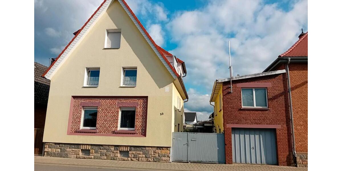 Wohnhaus miit Seitenbau und Garage 7 zimmer